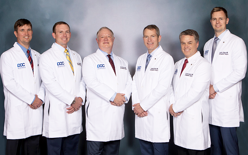 DOC Orthopaedics And Sports Medicine Physicians In Lab Coats